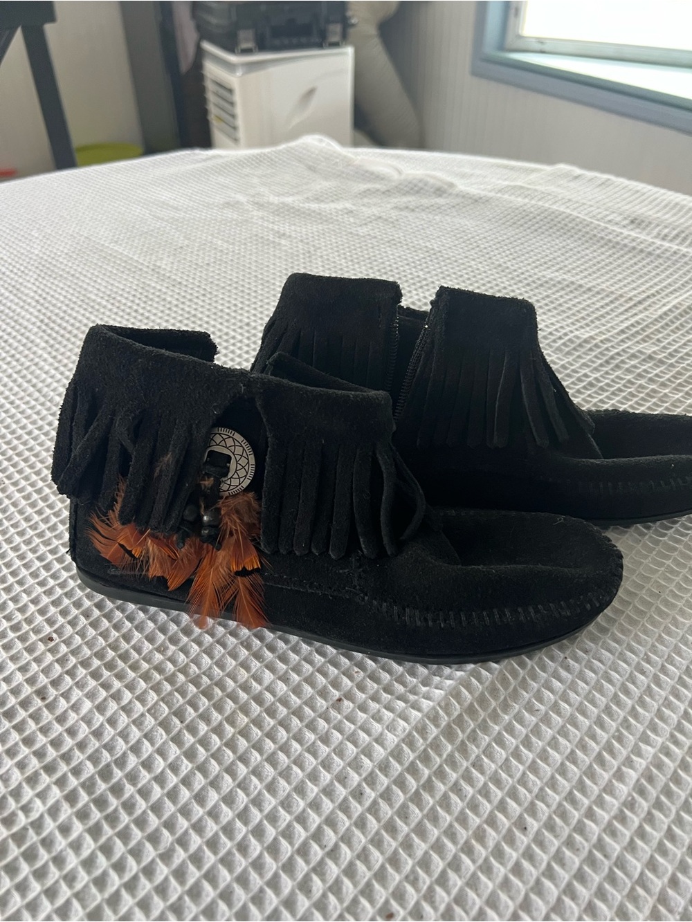 Minnetonka Black Suede Fringe Moccasins with Brown Feather Detail